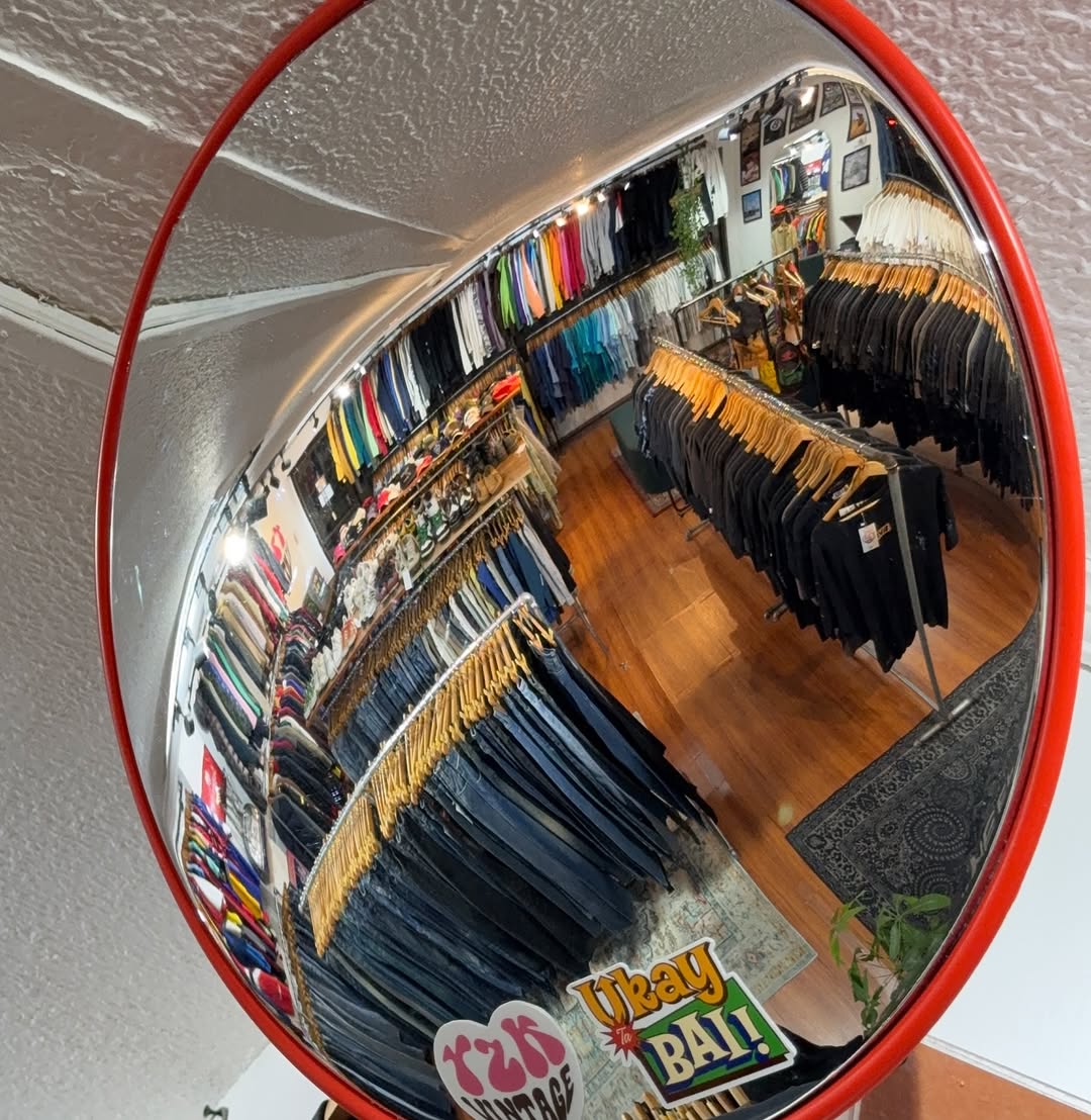 Y2K Vintage Cebu store interior — convex mirror reflecting colourful racks